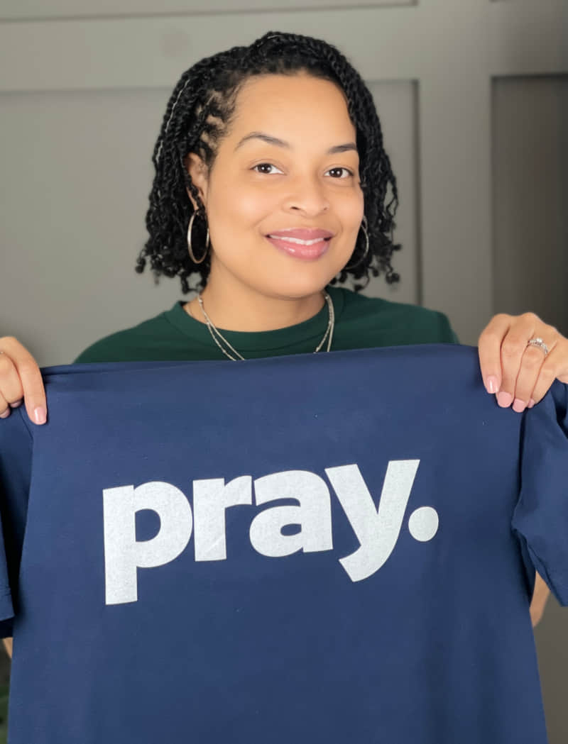 porsha holding up a tshirt